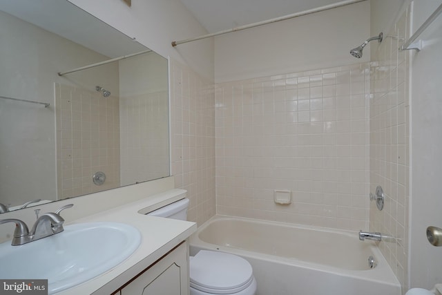 full bath featuring bathtub / shower combination, vanity, and toilet