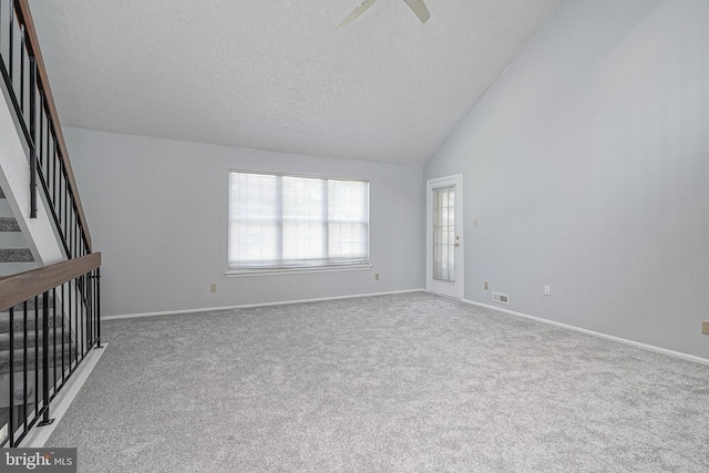 unfurnished living room with visible vents, baseboards, carpet, stairs, and a textured ceiling