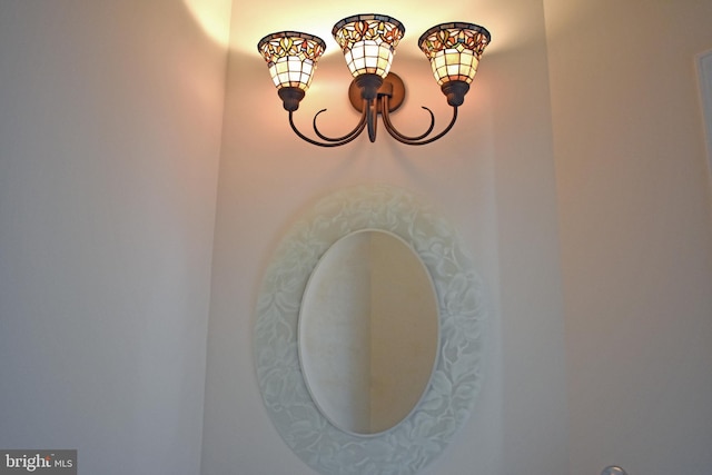 interior details featuring a chandelier