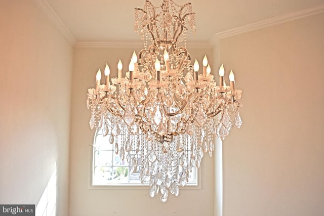 room details featuring an inviting chandelier and ornamental molding