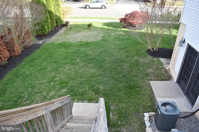 view of yard with central air condition unit