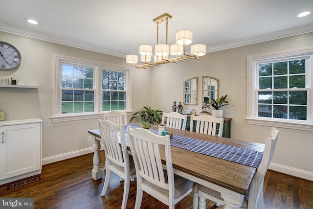 dining space featuring a notable chandelier, dark wood-style flooring, visible vents, baseboards, and ornamental molding