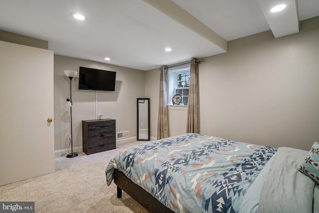 carpeted bedroom featuring recessed lighting, visible vents, and baseboards