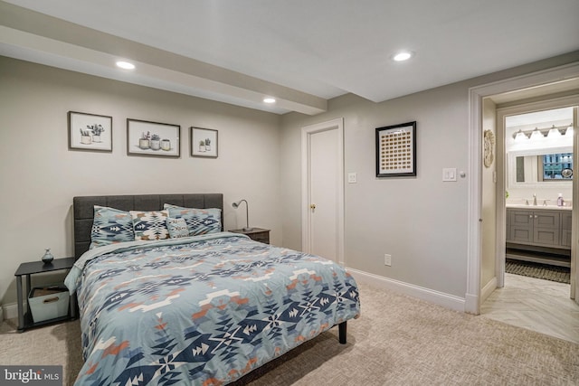 bedroom with light carpet, baseboards, a sink, and recessed lighting