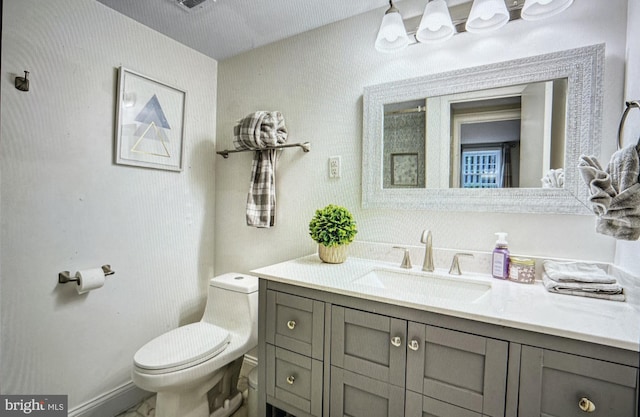 bathroom with vanity and toilet