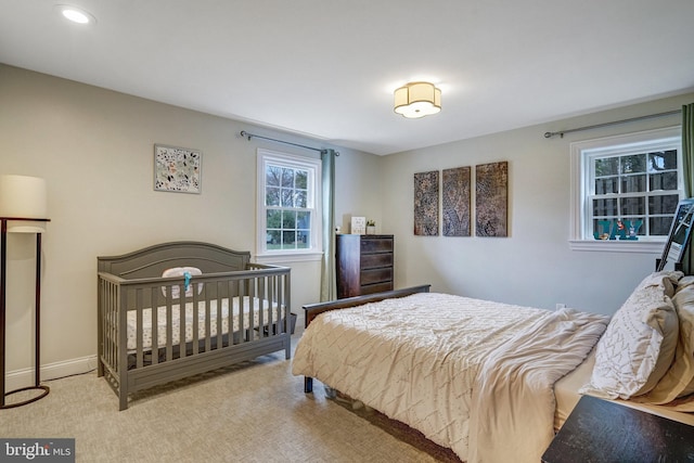 carpeted bedroom with baseboards