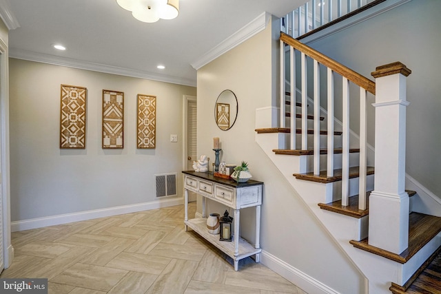 stairway featuring crown molding, visible vents, and baseboards