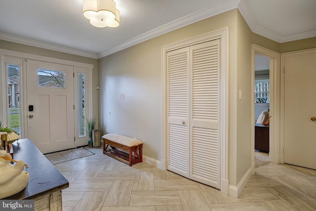 entrance foyer featuring baseboards and crown molding