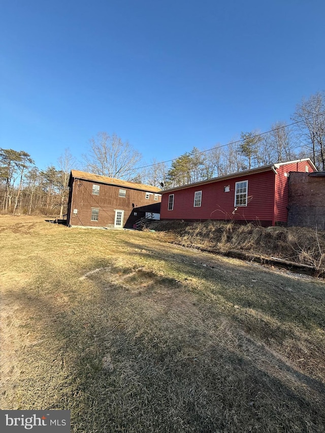 view of home's exterior with a yard