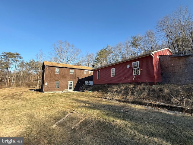 view of property exterior featuring a yard