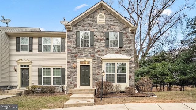 traditional home with stone siding