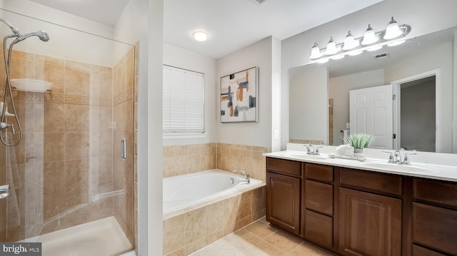 bathroom with tile patterned flooring, a sink, visible vents, a shower stall, and a bath