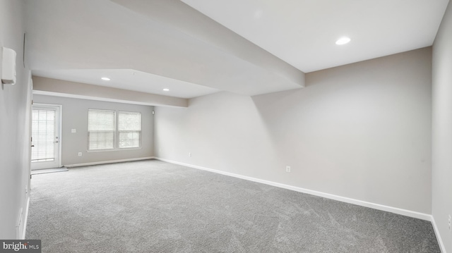 carpeted empty room featuring recessed lighting and baseboards