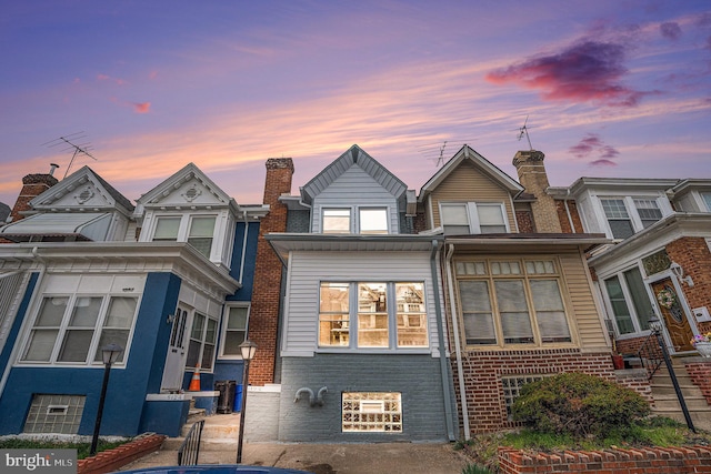5126 N Sydenham St, Philadelphia, PA 19141 - view of front of property with brick siding and a chimney