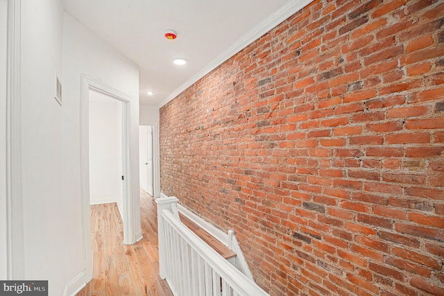 5126 N Sydenham St, Philadelphia, PA 19141 - hall featuring ornamental molding, light wood-style flooring, an upstairs landing, and brick wall