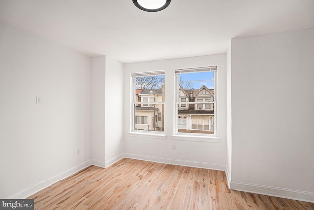 5126 N Sydenham St, Philadelphia, PA 19141 - unfurnished room with light wood-style floors and baseboards