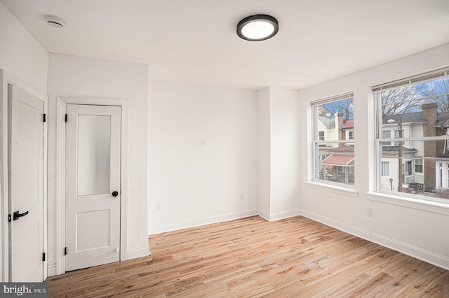 5126 N Sydenham St, Philadelphia, PA 19141 - empty room with baseboards and light wood-style floors
