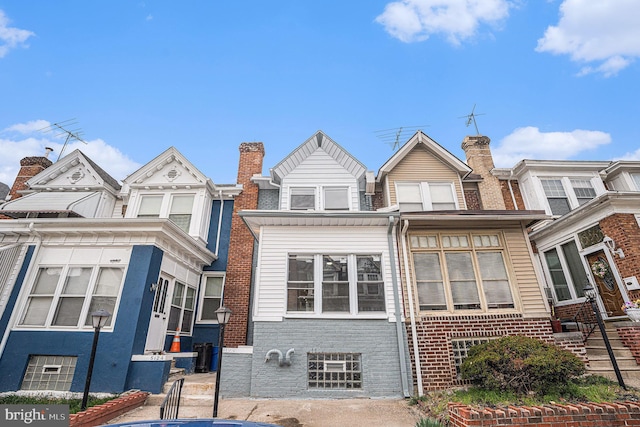 5126 N Sydenham St, Philadelphia, PA 19141 - view of front facade featuring a chimney and brick siding