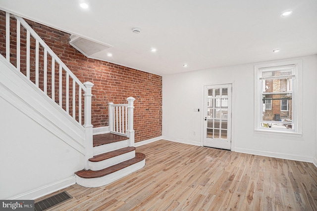 5126 N Sydenham St, Philadelphia, PA 19141 - interior space with visible vents, baseboards, brick wall, wood finished floors, and stairs