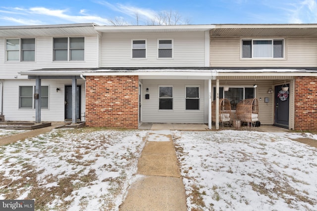 view of property with brick siding