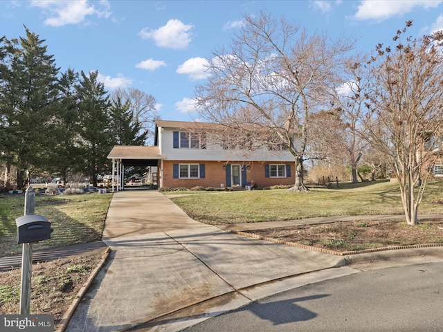 colonial home featuring driveway, an attached carport, a front lawn, and brick siding