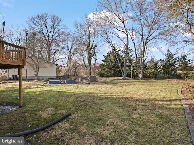 view of yard with a wooden deck