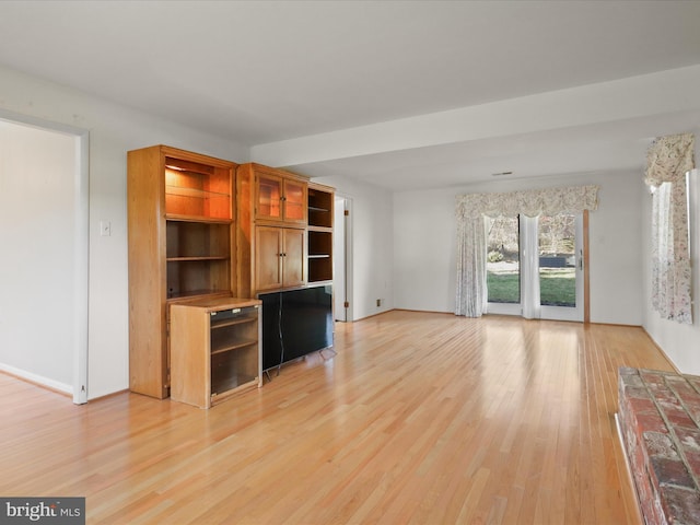 unfurnished living room with light wood-style floors