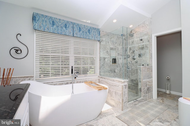 bathroom with tile walls, lofted ceiling, recessed lighting, a freestanding bath, and a stall shower