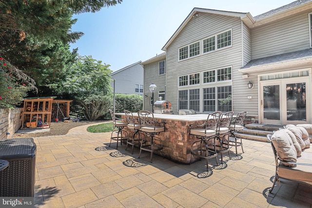 view of patio with outdoor dry bar