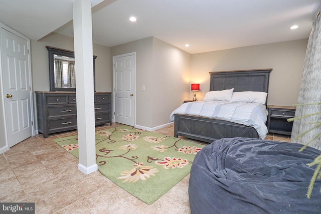 bedroom with recessed lighting and baseboards
