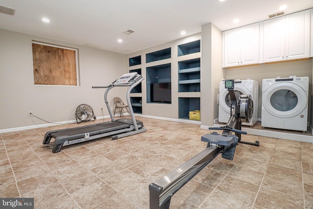 exercise room with built in shelves, visible vents, washer and dryer, and recessed lighting