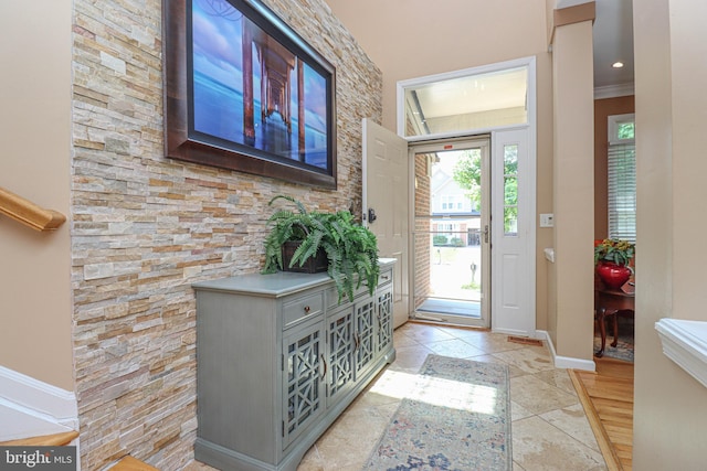 foyer entrance featuring baseboards