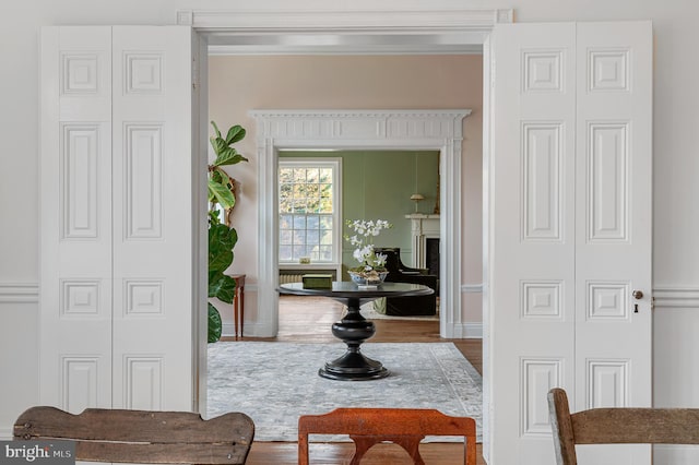 interior space with baseboards and wood finished floors