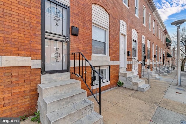 entrance to property with brick siding