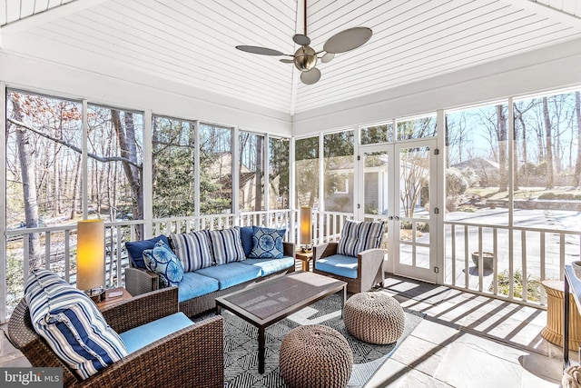 sunroom / solarium with ceiling fan and wood ceiling