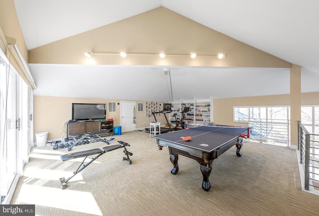 recreation room featuring carpet floors, high vaulted ceiling, visible vents, and baseboards