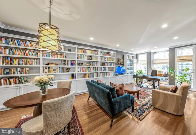 sitting room featuring ornamental molding, recessed lighting, and light wood finished floors