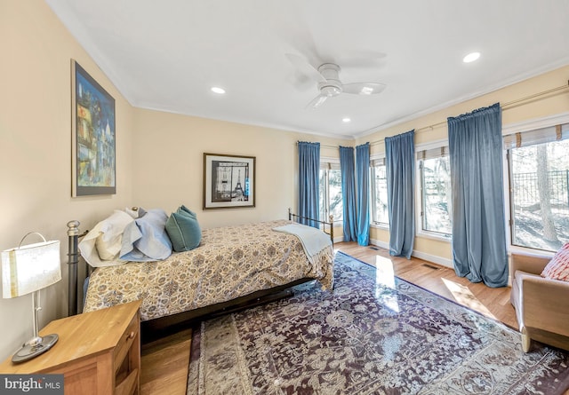 bedroom featuring recessed lighting, visible vents, baseboards, and wood finished floors