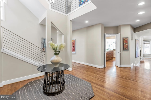 foyer entrance featuring recessed lighting, baseboards, and wood finished floors