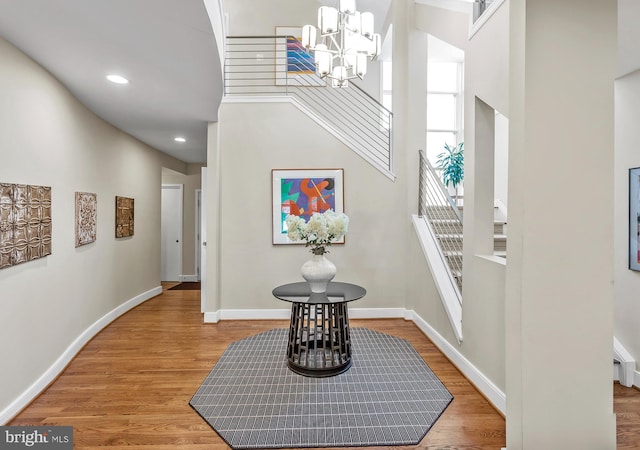 interior space featuring light wood-type flooring, baseboards, and recessed lighting