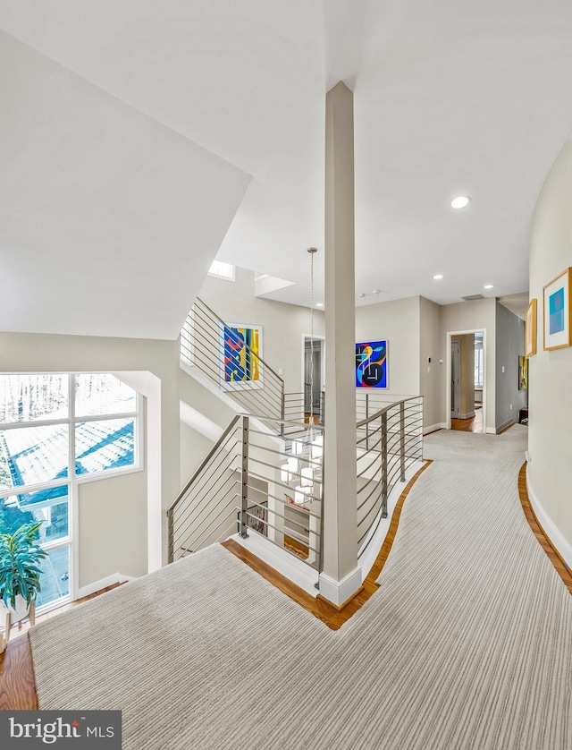 interior space featuring recessed lighting, baseboards, and wood finished floors