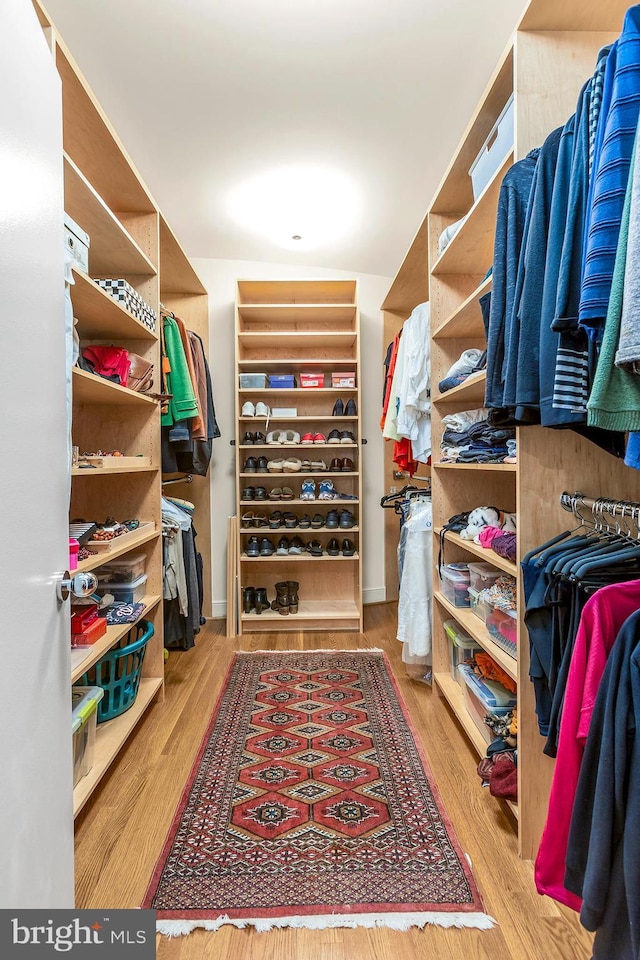 spacious closet with wood finished floors