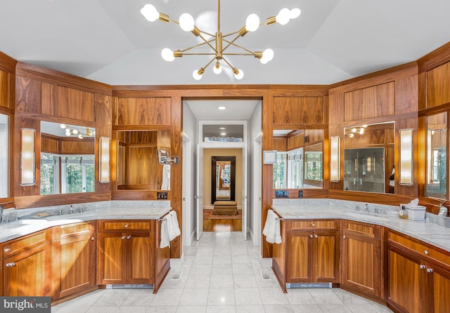 bathroom featuring lofted ceiling and vanity