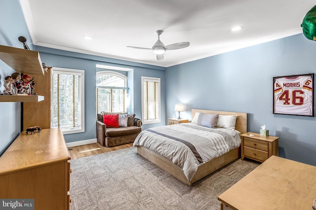 bedroom featuring recessed lighting, ornamental molding, a ceiling fan, wood finished floors, and baseboards