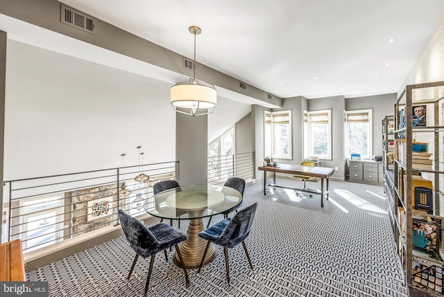 dining room with carpet and visible vents