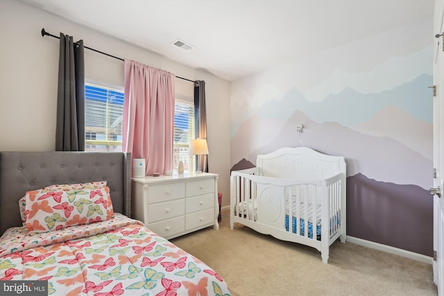 bedroom with light carpet, baseboards, and visible vents