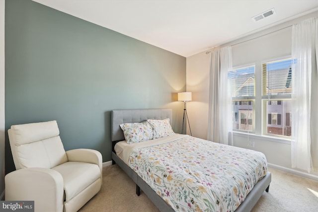 bedroom featuring carpet, visible vents, and baseboards