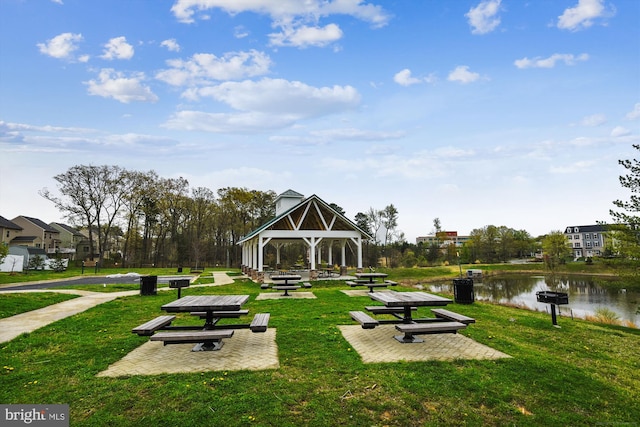 view of home's community featuring a water view, a lawn, and a gazebo