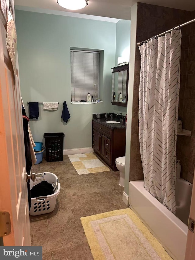 full bathroom with toilet, baseboards, vanity, and shower / bathtub combination with curtain