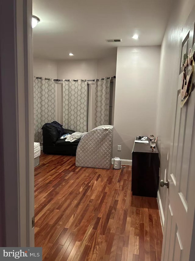 full bathroom with visible vents, baseboards, and wood finished floors